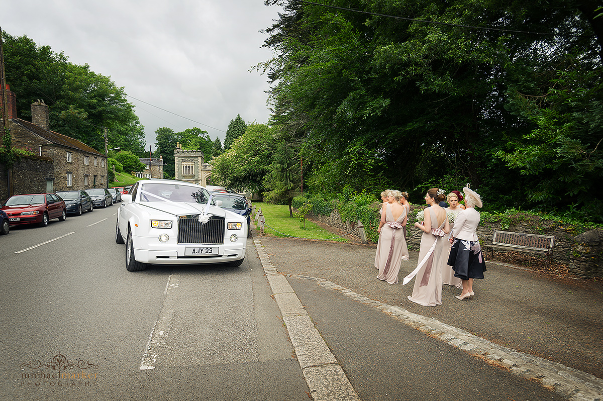 White Rolls Royce wedding car arrives at St Germans Church in Cornwall